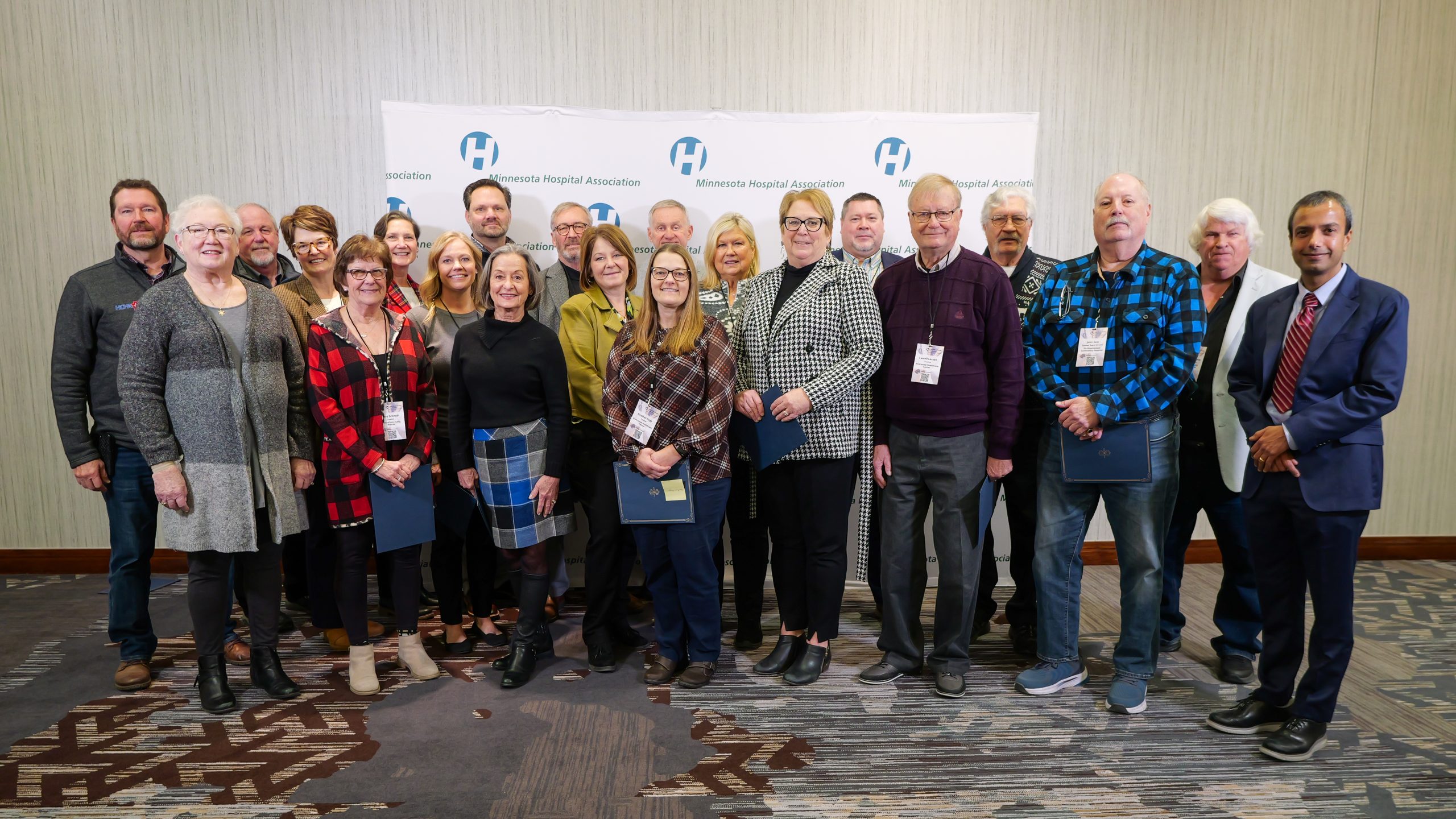 A group of professionals pose for a photo