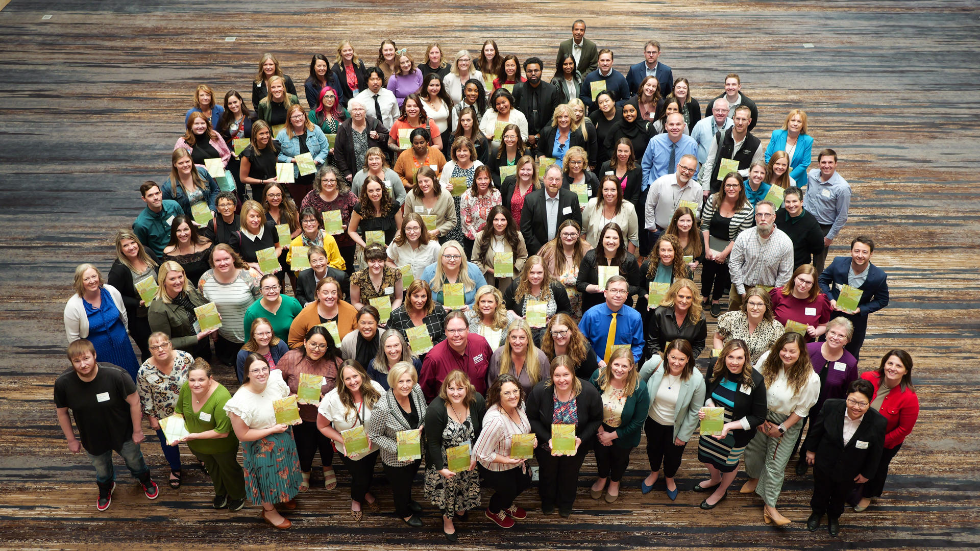a group of people holding awards
