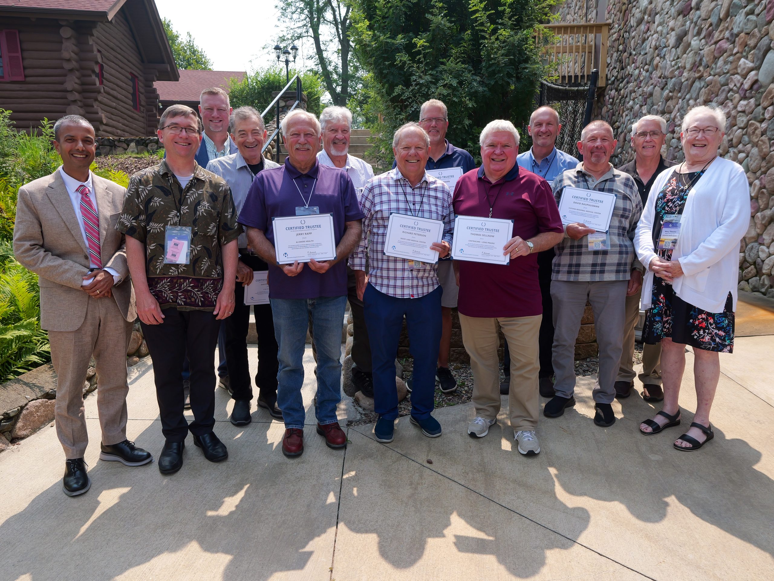 a group holding award plaques